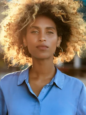 Young woman in Grand Rapids, MI stares at camera after scheduling her appointment at HELP Pregnancy Aid.